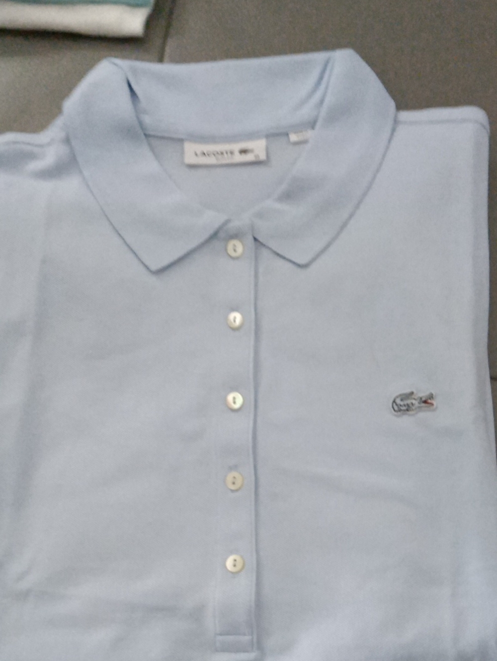 Lacoste Light Blue Men's Polo Shirt with Pearl Buttons and soft luxurious feel